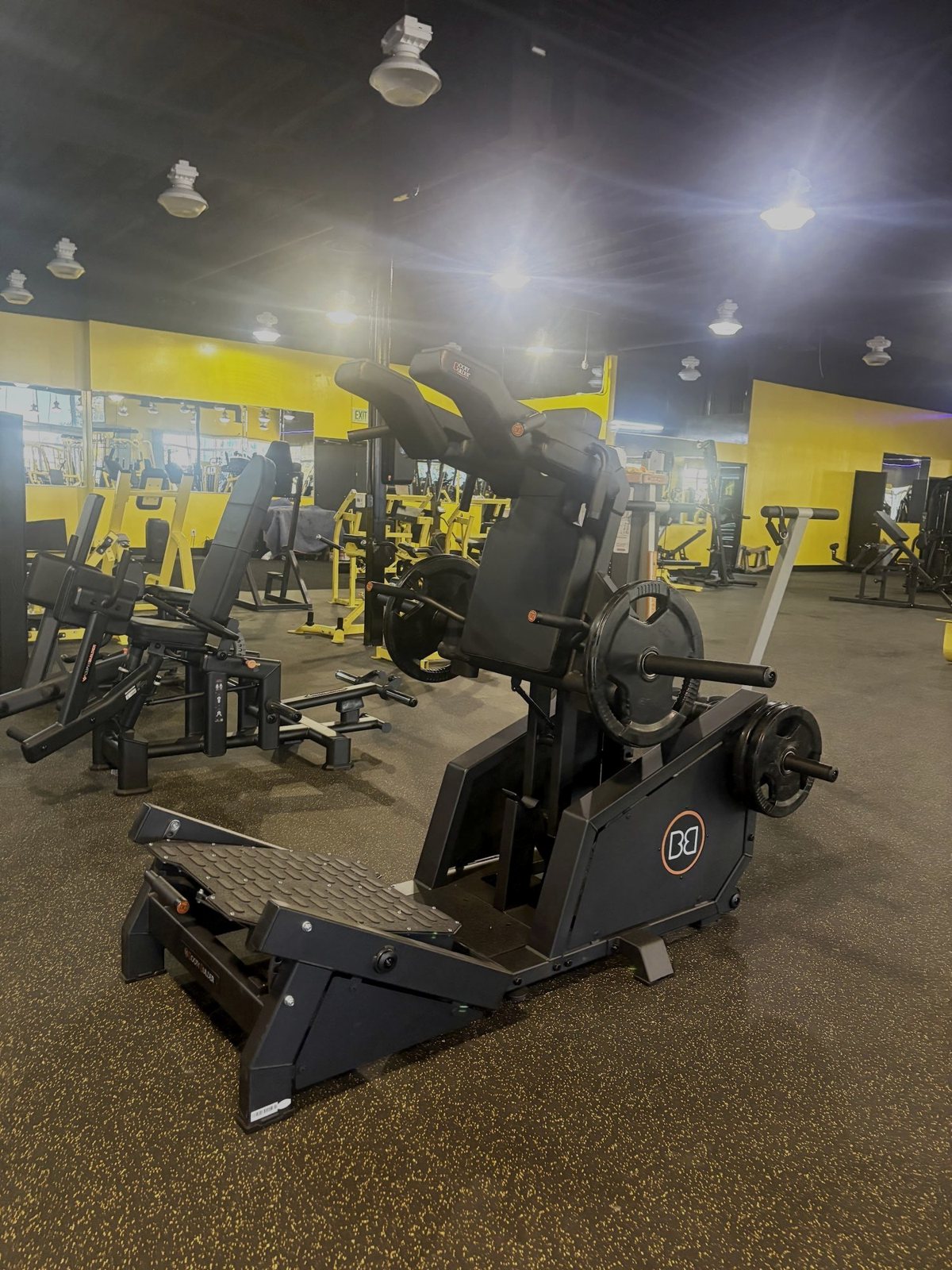 Strength floor with yellow machines at Fit Nation Ontario